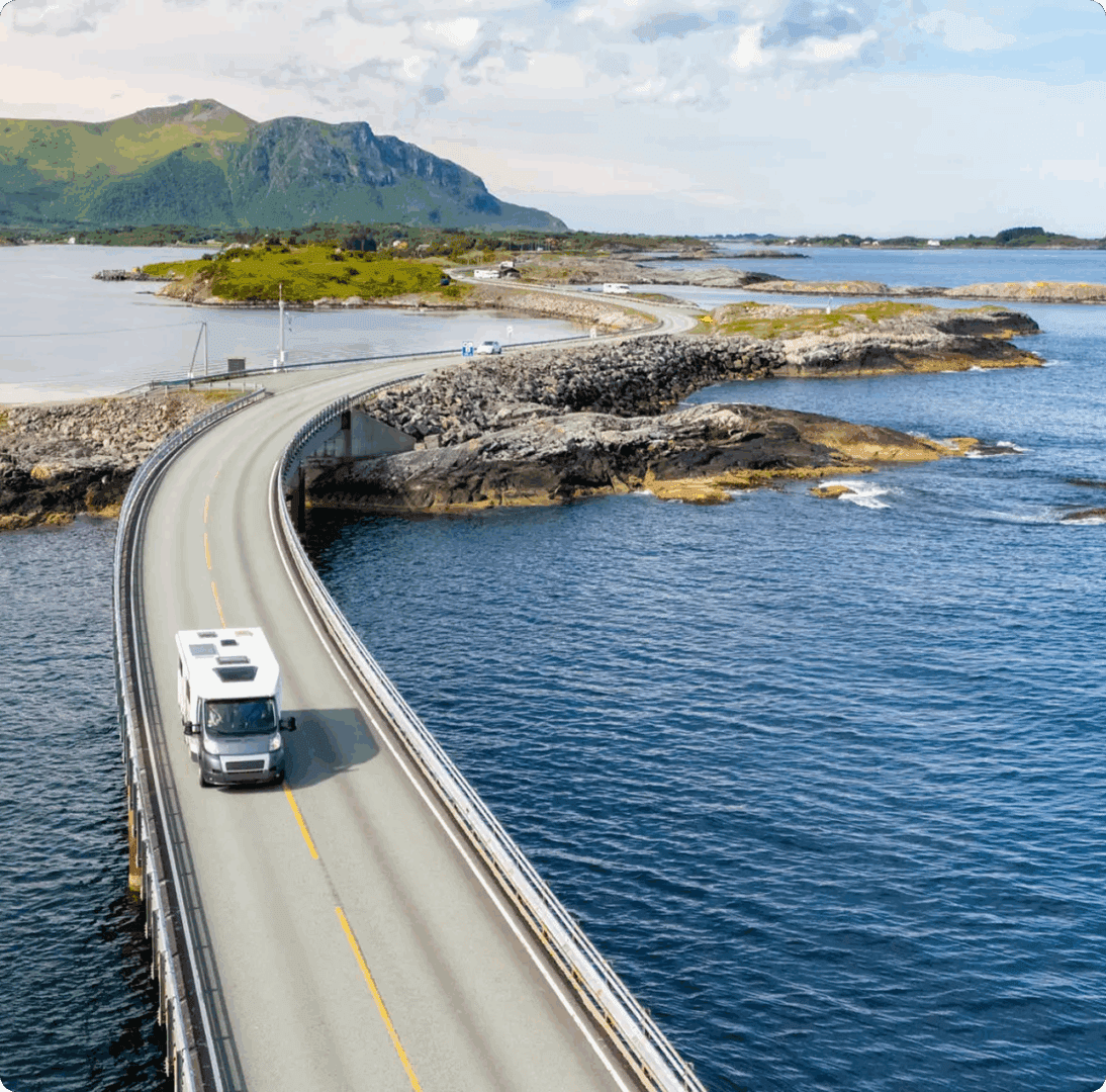 RV traveling on winding ocean road